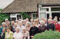 A Tin Hut reunion in 1993. Joan is in a dark dress, standing in the centre of the front row. Permission from Joan Travis, with captioning help from Olaf Chedzoy.