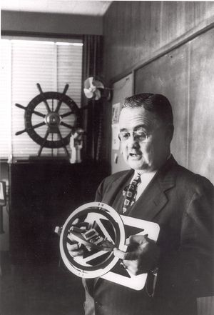 0529 - Charles Stark Draper holding gyroscope.jpg